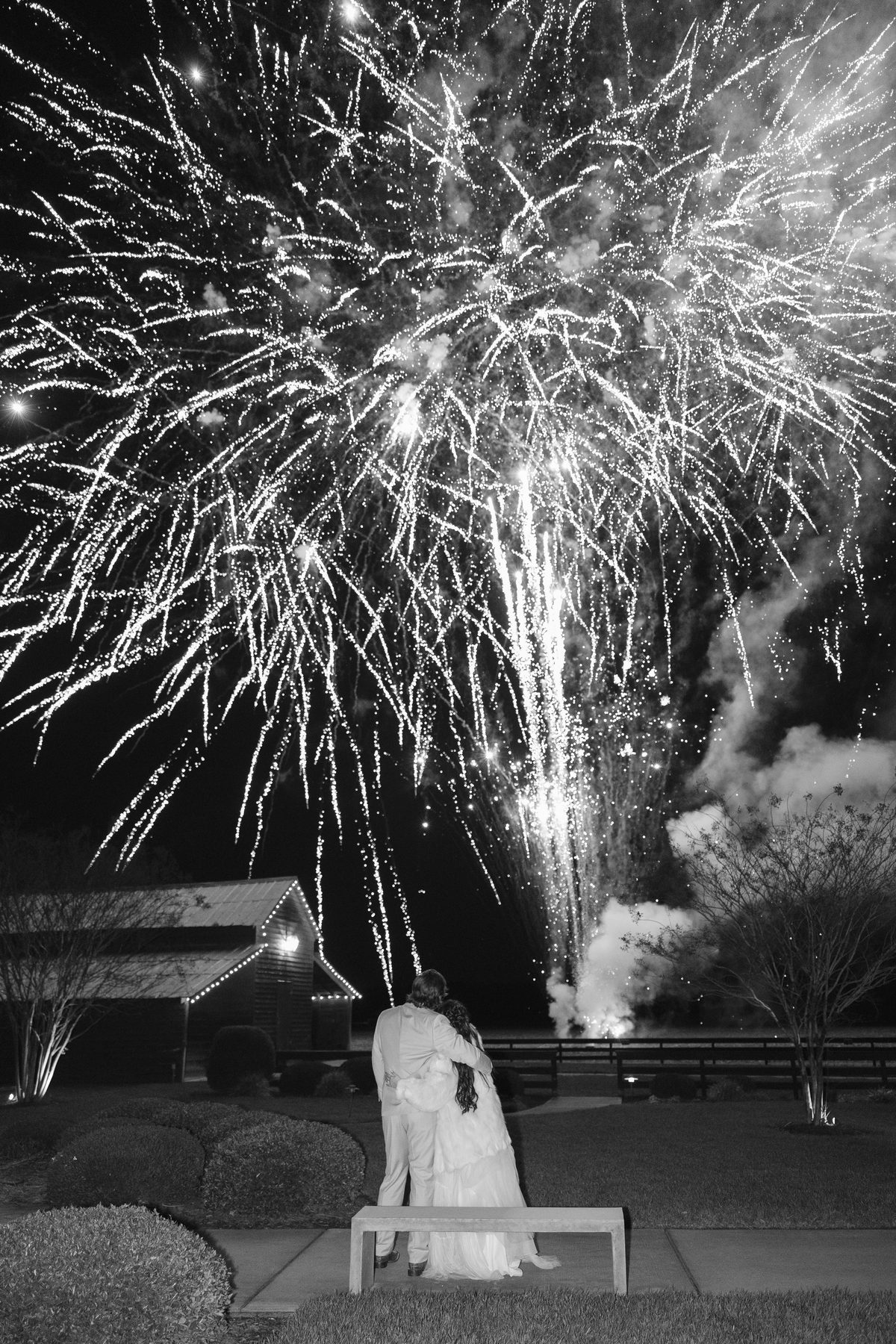 Fireworks bursting above a wedding celebration